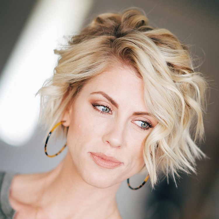long blonde hair pixie cut woman thinking about her hairstyle